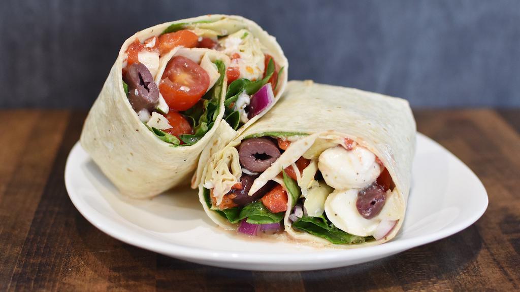 Tuscan Wrap · Baby spinach, red onion, mozzarella, artichoke hearts, roasted red peppers, kalamata olives, grape tomatoes, and croutons with tuscan vinaigrette in your choice of wrap.