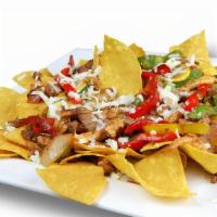 Nachos Fajita · Nachos topped with your favorite steak or chicken and mixed with squash, zucchini, mushrooms...