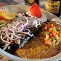 Enchiladas De Mole Poblano / Chicken Enchiladas Chocolate Peanut Sauce · Three rolled up corn tortillas stuffed with shredded chicken (substitutions available) and t...