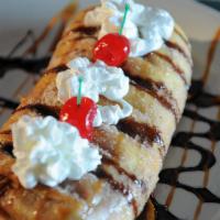 Sopapilla · A large flour tortilla wrapped with sour cream, strawberry, and banana, deep fried and toppe...