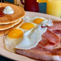 #4 · 3 eggs your way, king slice of ham off the bone and choice of 3 buttermilk pancakes or 3 thi...