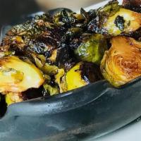 Caramelized Brussels Sprouts · Brown sugar, butter, and black pepper.