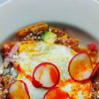 Chilaquiles* · Brisket chili, radishes, cotija, pickled red onion, pico de gallo, avocado, fried corn torti...