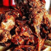 Chicken & Waffle · Slow cooked, buttermilk-fried chicken breast and leg with bacon and thyme grade a syrup on t...