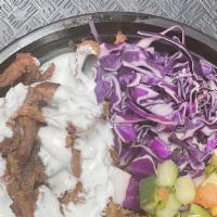 Steak Shawarma Bowl · Served with rice, topped with steak shawarma, hummus, 2 falafel,  Zam Zam salad, red cabbage...