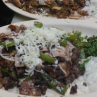 El Tiro Libre · Pork chop, ham, bacon, cheese, and seasoned pork. Served with cilantro, onion and tortilla.