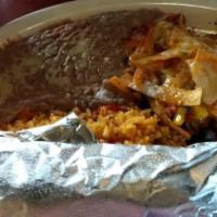 Pollo Margarita · Grilled marinated chicken breast, cooked with black bean corn salsa, in tortilla strips, ser...