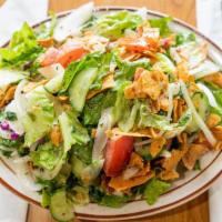 Fattoush Salad · A large salad mixed with toasted pita Bread. Vegetarian.