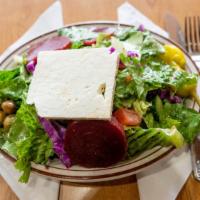 Greek Salad · Romaine, feta cheese, beets, green olives, tomatoes, onions, and cucumbers. Vegetarian.
