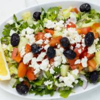Shepherd Salad · Tomatoes, cucumbers, onions, peppers, cheese, lettuce, olives and parsley with dressing.