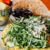 Spinach Frittata. · spinach, brie, fresh herbs, roasted tomatoes, parmesan, hashbrowns, toast