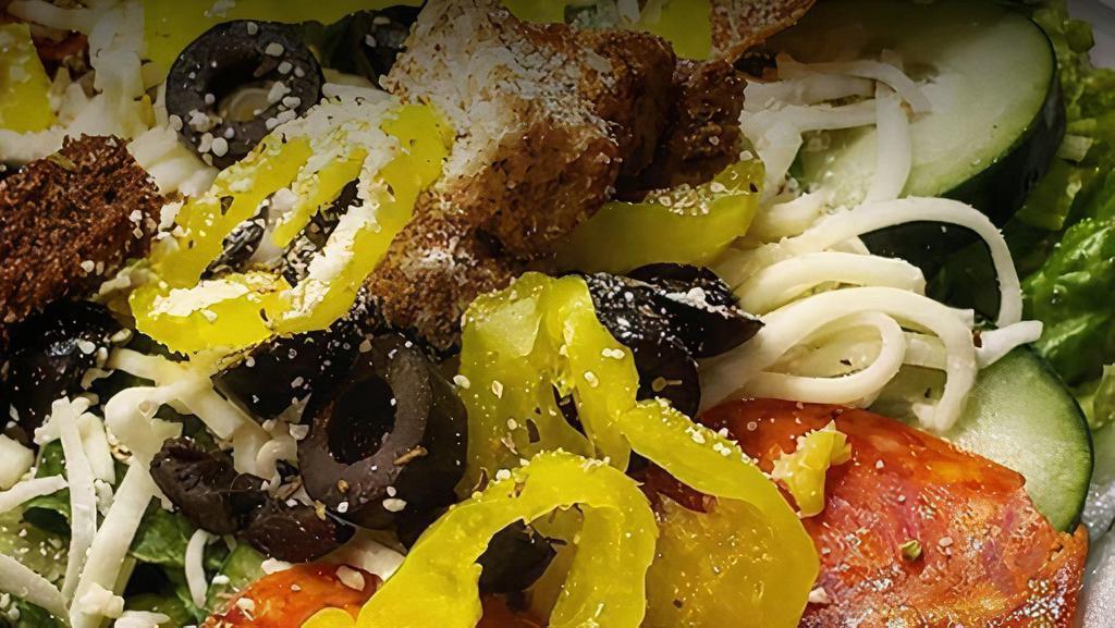 Big Italian Salad · Serves 2 to 3. Romaine, tomatoes, cucumber, pepperoni, croutons, banana peppers, black olives, green peppers, onions, grated parmesan and Italian dressing on the side.