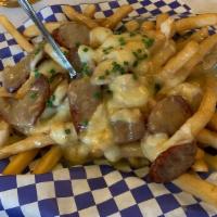 Alpine Poutine · Imagine an apres snack in the Bavarian alps. Fries loaded with scratch made duck gravy, curd...