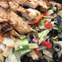 South Of The Border · House blond greens topped w/ grilled chicken, black beans, radish, jalapeno slices, diced ma...