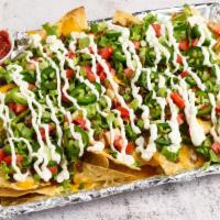 Loaded Nachos -Loaded Bites · Hot. Loaded nachos, lettuce, scallions, black beans, Jalapeños, tomatoes, cheese, salsa and ...