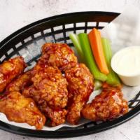 Traditional Wings · Six piece bone in wings with celery carrots and choice of ranch or bleu cheese.