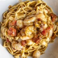 Pasta Genovese Di Mare · Shrimp and scallops sauteed in a fresh Fire Roasted tomato sauce and white wine finished wit...