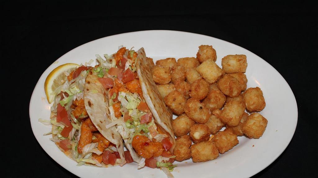 Boom Boom Shrimp Tacos · 2 soft flour tortillas filled with corkscrew fried shrimp tossed in our special boom boom sauce then topped with shredded lettuce, cheese and tomatoes.