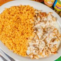 Arroz Con Pollo Specialty · Grilled seasoned tender chicken, over Mexican rice and topped with cheese.