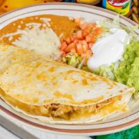 Quesadilla Rellena · A flour tortilla grilled and stuffed with cheese, chopped beef or chicken, and refried beans...