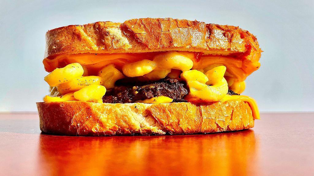 Mac Meltdown · Toasted grilled cheese meat melt with meltdown sauce and mac and cheese, your choice of cheese and meat.