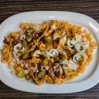 Chori Chicken · A bed of rice covered with grilled chicken and chorizo, topped with cheese sauce and jalapeñ...