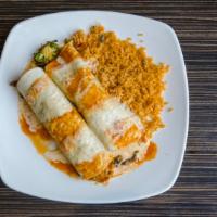Burritos Potrillo · Two flour tortillas wrapped around grilled shrimp, steak, chorizo, broccoli, pineapple and j...