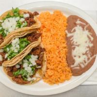 Taco Dinner · Three tacos with your choice of meat, served with rice and beans.
One meat only