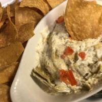 Artichoke Dip · Warm artichoke dip topped with diced tomatoes and grated parmesan cheese with warm tortilla ...
