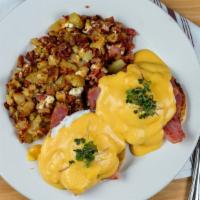 Classic Benedict · Poached eggs and ham over english muffin topped with our homemade hollandaise sauce