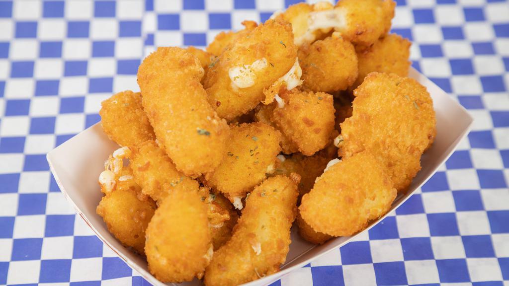 Cheese Curds · Wisconsin white cheddar curds, battered and fried