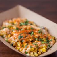 Elote · Roasted corn with garlic aioli, queso cotija, smoked paprika/cayenne blend, dried cilantro