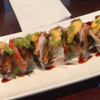 Godzilla Roll · Spicy salmon, avocado, and crunchy inside, cel, crabmeat, and tobiko on top.