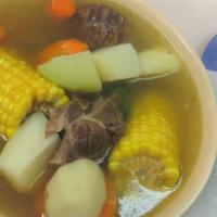 Menudo · Beef tripe stew with peppers and spices.