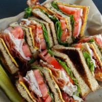 Classic Turkey Club · Deli turkey stacked in a three tier club-style with Applewood smoked bacon, American cheese,...