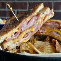 Grilled Ham And Cheese · A classic taste combination of shaved Dearborn ham and American cheese! Served as a triple d...