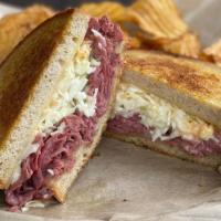 Dinty Moore · Grilled corned beef, Swiss cheese, Thousand Island dressing and house made coleslaw on grill...