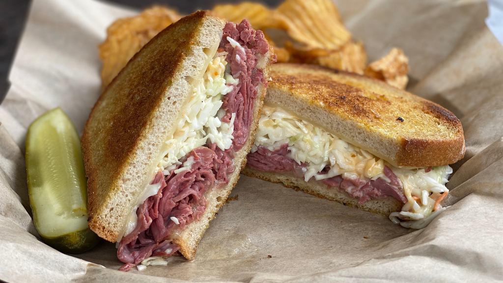 Dinty Moore · Grilled corned beef, Swiss cheese, Thousand Island dressing and house made coleslaw on grilled rye bread