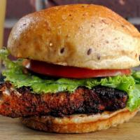 Blackened Salmon Sandwich · Blackened grilled salmon, lettuce, and tomato. Served on a grilled brioche bun