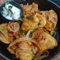 1/2 Dozen Potato & Cheese Pierogies · Stuffed with potato and cheese. Served with sautéed onions and sour cream
