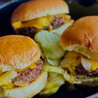 American Slider Trio · Three sliders topped with American cheese, grilled onions and pickles