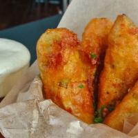 Craft Beer Battered Pickles · Hand-cut and battered pickle spears deep-fried and
served with Sriracha ranch
