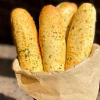 Garlic Bread Sticks Appetizer · Four fresh baked, brushed with garlic butter and topped with Parmesan cheese. Served with a ...