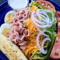 Chef'S Salad · Crisp tossed greens topped with Dearborn ham,
cheddar cheese, hard-boiled egg, tomatoes, red...