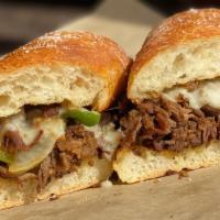 Philly Cheese Steak Grinder · Thinly sliced sirloin steak with Swiss cheese, sautéed onions, green peppers and mayo