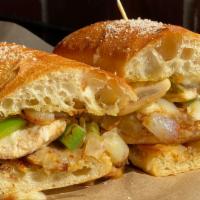 Smothered Chicken Grinder · Grilled chicken breast topped with house cheese blend, sautéed onions, green peppers, mushro...