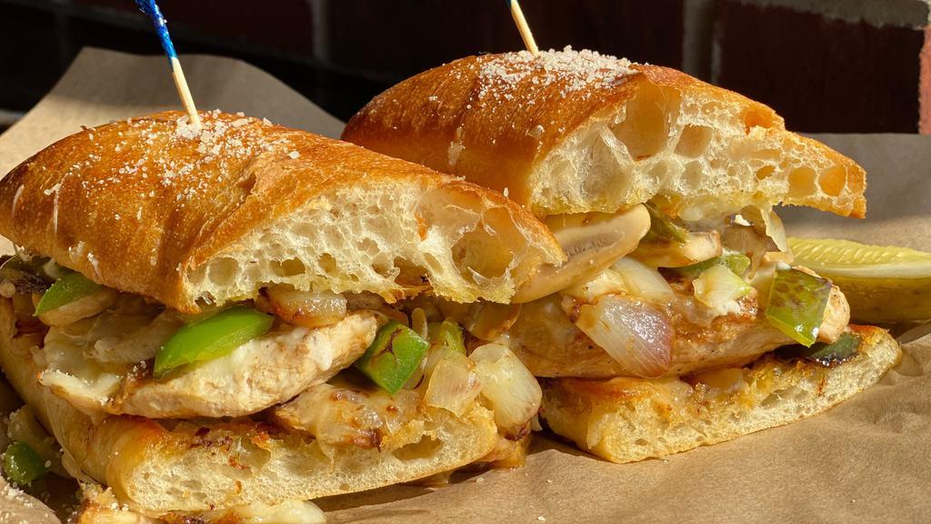 Smothered Chicken Grinder · Grilled chicken breast topped with house cheese blend, sautéed onions, green peppers, mushrooms and mayo