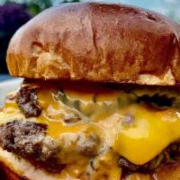 Gotham Smash Burger · Double stacked American cheeseburger smashed flat on the grill with caramelized onions. Serv...