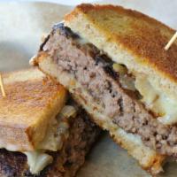 Patty Melt · Beef patty smothered with grilled onions and topped with melted Swiss cheese. Served on gril...