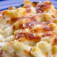 Baked Mac & Cheese · Our house six-cheese blend paired with bits of Applewood smoked bacon, smothered over cavata...